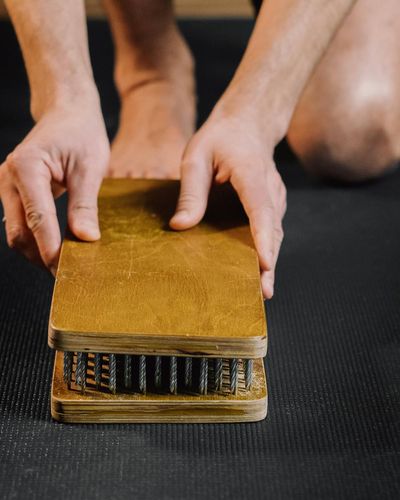Close-up of a person's hands in a mindful position during practice.
